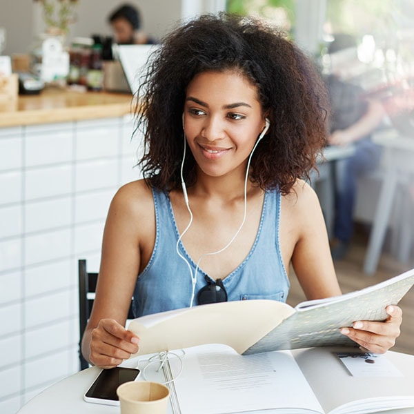 Woman reading a notebook